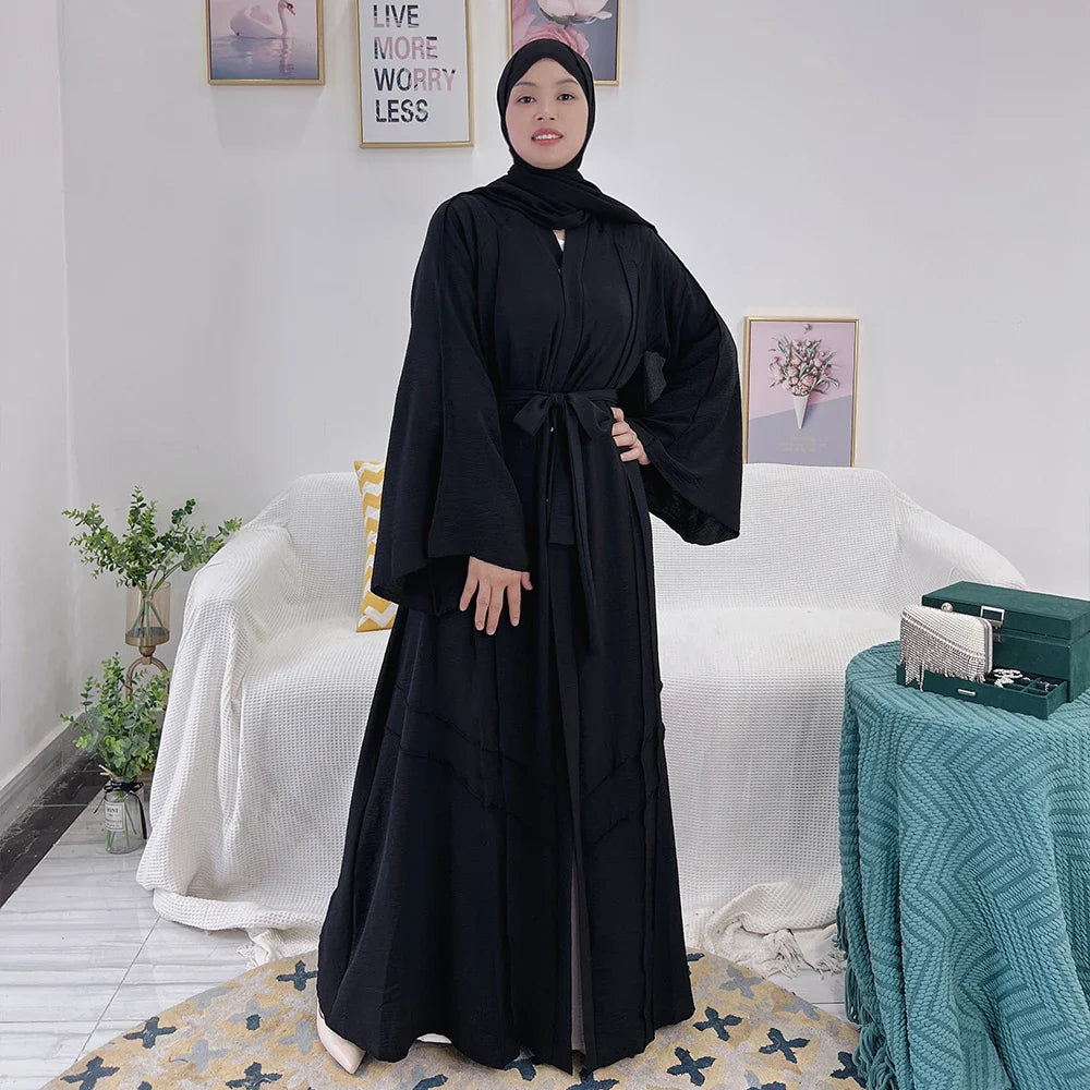 Loriya vente chaude conçoit des vêtements islamiques en polyester froissé noir abaya uni modeste abaya robe pour femmes musulmanes 